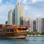 Abu Dhabi Dhow Cruise with city skyline.