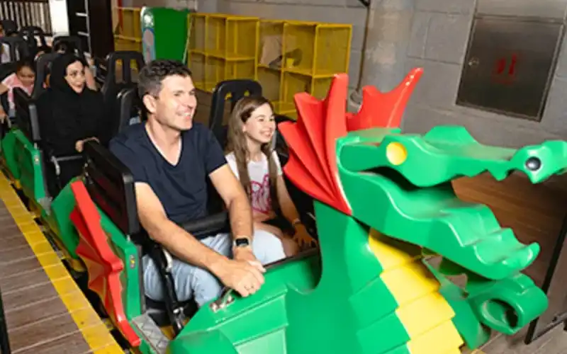 Kids enjoying the dragon ride at Legoland Dubai.
