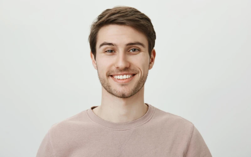 Guy smiling broadly for photo