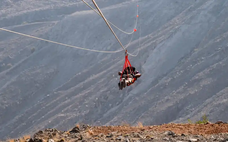 A man doing Zipline in Ras Al Khaimah.