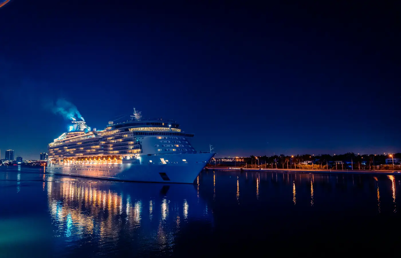 Luxury cruise ship illuminated at night